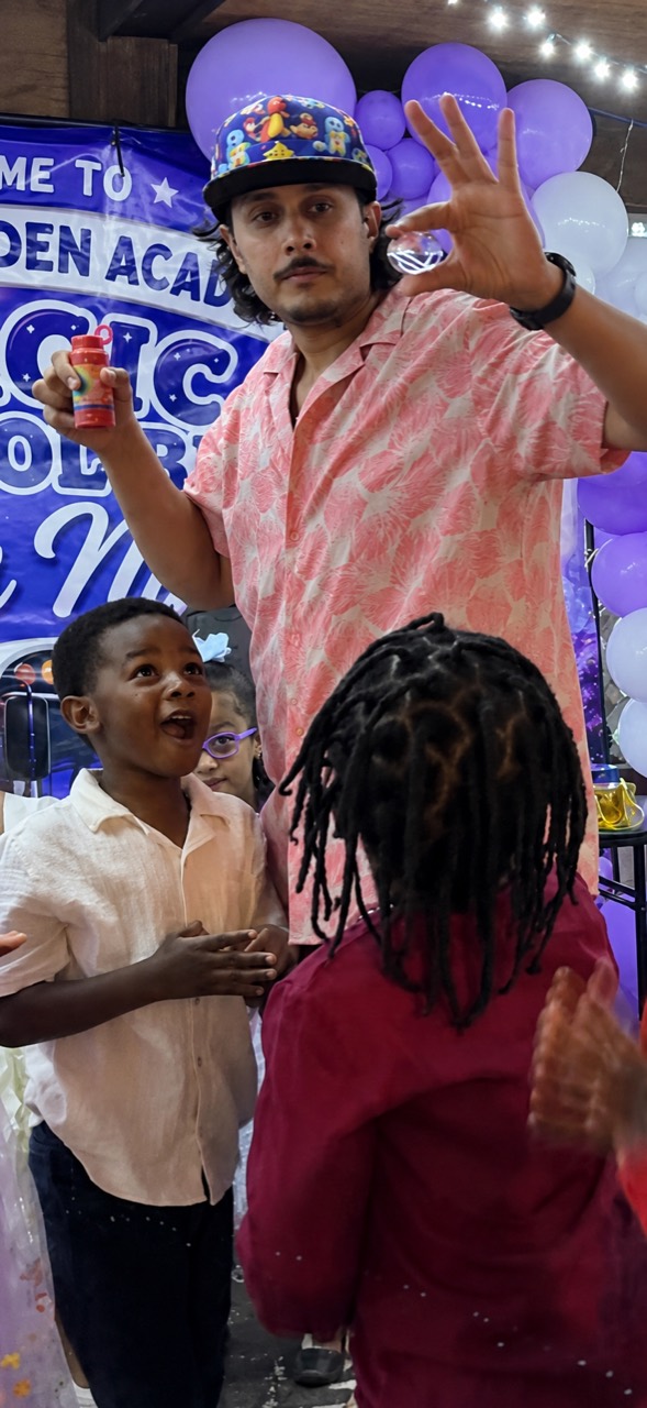 Om Jae performing bubbles for amazed kids